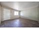 A simple, bright living room with fresh paint and flooring and a large window at 1614 S 6Th Ave, Phoenix, AZ 85003