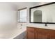 Bathroom featuring a tub and shower combo with an oak vanity at 1632 E Leslie Ave, San Tan Valley, AZ 85140