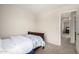 Bedroom with a bed and bedding, with a view into the hallway and bathroom at 1632 E Leslie Ave, San Tan Valley, AZ 85140