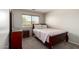 Bedroom with a dresser, a window with blinds, and a wood-framed bed at 1632 E Leslie Ave, San Tan Valley, AZ 85140