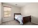 Bedroom featuring a twin-sized bed, window with blinds, and neutral walls at 1632 E Leslie Ave, San Tan Valley, AZ 85140