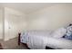 A neutral bedroom showcasing a bed with blue bedding and a sliding-door closet at 1632 E Leslie Ave, San Tan Valley, AZ 85140