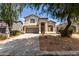 Charming two-story home with a well-manicured front yard and a two car garage at 1632 E Leslie Ave, San Tan Valley, AZ 85140