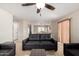 Comfortable living room featuring neutral walls, tiled floors, and a ceiling fan at 1632 E Leslie Ave, San Tan Valley, AZ 85140