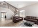 Inviting living room featuring high ceilings, staircase and tile flooring, with lots of natural light at 1632 E Leslie Ave, San Tan Valley, AZ 85140
