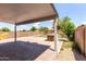 Covered patio with brick pavers and a built-in BBQ area, perfect for outdoor living at 1632 E Leslie Ave, San Tan Valley, AZ 85140