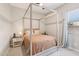 Bedroom with a four poster bed, neutral tones, and a ceiling fan at 1865 N 141St Ave, Goodyear, AZ 85395