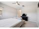 View of bedroom with a bed, black dresser, and ceiling fan at 1865 N 141St Ave, Goodyear, AZ 85395