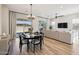 Bright dining area with backyard views, seamlessly connected to living room at 1865 N 141St Ave, Goodyear, AZ 85395