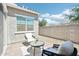 Cozy patio with brick pavers, comfortable seating, and a view of the serene backyard at 1865 N 141St Ave, Goodyear, AZ 85395