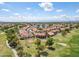 Aerial view of a residential area, highlighting the location of a house near a golf course at 18851 N 69Th Ave, Glendale, AZ 85308