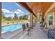 Inviting backyard with covered patio, sparkling pool, manicured lawn and ample seating at 18851 N 69Th Ave, Glendale, AZ 85308