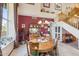 Dining room with a large round table, stairs and nice natural light at 18851 N 69Th Ave, Glendale, AZ 85308