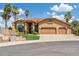 Charming home features a three-car garage, manicured lawn, desert landscaping and inviting curb appeal at 18851 N 69Th Ave, Glendale, AZ 85308