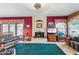Cozy living room with fireplace, windows with blinds and lots of light at 18851 N 69Th Ave, Glendale, AZ 85308