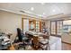 Functional office space with desk, shelving, and outdoor access at 18851 N 69Th Ave, Glendale, AZ 85308