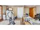 Large office with exercise equipment, closet and outdoor access at 18851 N 69Th Ave, Glendale, AZ 85308