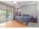 Bedroom with backyard access via a sliding glass door and neutral decor at 2111 E Yellowstone Pl, Chandler, AZ 85249