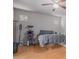 Minimalist bedroom with a ceiling fan and warm-toned wood floor at 2111 E Yellowstone Pl, Chandler, AZ 85249