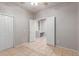 Bedroom featuring tile flooring, a closet, and access to a separate office at 2111 E Yellowstone Pl, Chandler, AZ 85249