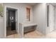 Hallway with built-in desk nook featuring natural light and a neutral palette at 2111 E Yellowstone Pl, Chandler, AZ 85249