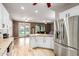 Spacious kitchen with stainless steel refrigerator and an open view to the living room at 2111 E Yellowstone Pl, Chandler, AZ 85249