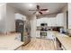 Well-lit kitchen features stainless steel appliances, white cabinetry, and stylish countertops at 2111 E Yellowstone Pl, Chandler, AZ 85249