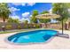 Inviting backyard pool with an umbrella and mature landscaping at 2111 E Yellowstone Pl, Chandler, AZ 85249