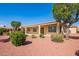 Spacious covered patio and landscaped yard perfect for outdoor living and entertaining at 22222 N Pedregosa Dr, Sun City West, AZ 85375