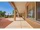 Covered back patio offering serene views of the landscaped yard at 22222 N Pedregosa Dr, Sun City West, AZ 85375