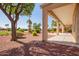 Relaxing covered back patio overlooking a beautifully landscaped yard and golf course view at 22222 N Pedregosa Dr, Sun City West, AZ 85375