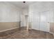 Bedroom features tile flooring, neutral wall paint, closet with mirrored doors, and a ceiling fan at 22222 N Pedregosa Dr, Sun City West, AZ 85375