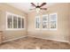 Bright room with plantation shutters, neutral walls, and tile flooring at 22222 N Pedregosa Dr, Sun City West, AZ 85375