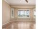 A bright and airy bedroom features tile flooring, ceiling fan, and plantation shutters for ample natural light at 22222 N Pedregosa Dr, Sun City West, AZ 85375