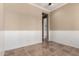 Room featuring tile flooring, ceiling fan, wainscotting and a neutral paint color creating a serene atmosphere at 22222 N Pedregosa Dr, Sun City West, AZ 85375