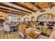A spacious restaurant and dining area with rustic wooden beams and ample seating at 22222 N Pedregosa Dr, Sun City West, AZ 85375