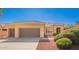 Charming single-story home featuring a two-car garage, neutral colors, and tidy landscaping at 22222 N Pedregosa Dr, Sun City West, AZ 85375
