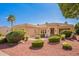 Inviting single-story home with a well-manicured lawn, desert landscaping, and charming curb appeal at 22222 N Pedregosa Dr, Sun City West, AZ 85375