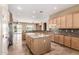Gorgeous kitchen with granite counters, stainless steel appliances, and a center island at 22222 N Pedregosa Dr, Sun City West, AZ 85375