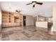 Spacious living room with custom built-ins, neutral paint, and recessed lighting at 22222 N Pedregosa Dr, Sun City West, AZ 85375