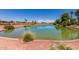 A serene pond surrounded by lush landscaping, perfect for relaxation and enjoyment at 22222 N Pedregosa Dr, Sun City West, AZ 85375