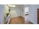 Bright entryway featuring wood floors, neutral walls, and view of a bedroom at 2505 E Desert Cactus St, Phoenix, AZ 85032