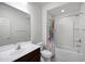 Clean bathroom featuring shower over tub, decorative shower curtain, and a neutral color scheme at 25974 W Horsham Dr, Buckeye, AZ 85396