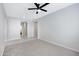 Spacious bedroom with neutral carpet, light gray walls, and ample natural light at 25974 W Horsham Dr, Buckeye, AZ 85396