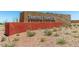 Festival Foothills community sign featuring desert landscaping and a textured stone accent wall at 25974 W Horsham Dr, Buckeye, AZ 85396