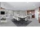 Open concept dining room flows into kitchen, offering ample seating and a seamless entertaining space at 25974 W Horsham Dr, Buckeye, AZ 85396