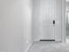 Clean entryway with tile flooring and a white front door, providing a welcoming feel at 25974 W Horsham Dr, Buckeye, AZ 85396