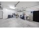Spacious garage with overhead storage, organized shelving, and room for parking at 25974 W Horsham Dr, Buckeye, AZ 85396