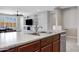 Stylish kitchen with stainless steel sink, countertops, and a view into the open living area at 25974 W Horsham Dr, Buckeye, AZ 85396