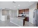 Modern kitchen featuring a large center island, stainless appliances, and ample counter space at 25974 W Horsham Dr, Buckeye, AZ 85396